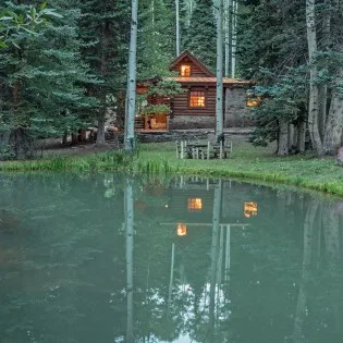 mountain village vacation rental yellow brick cabin pond